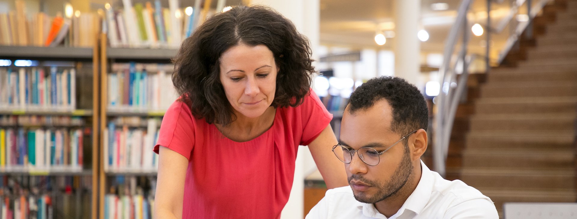 Educator helping student