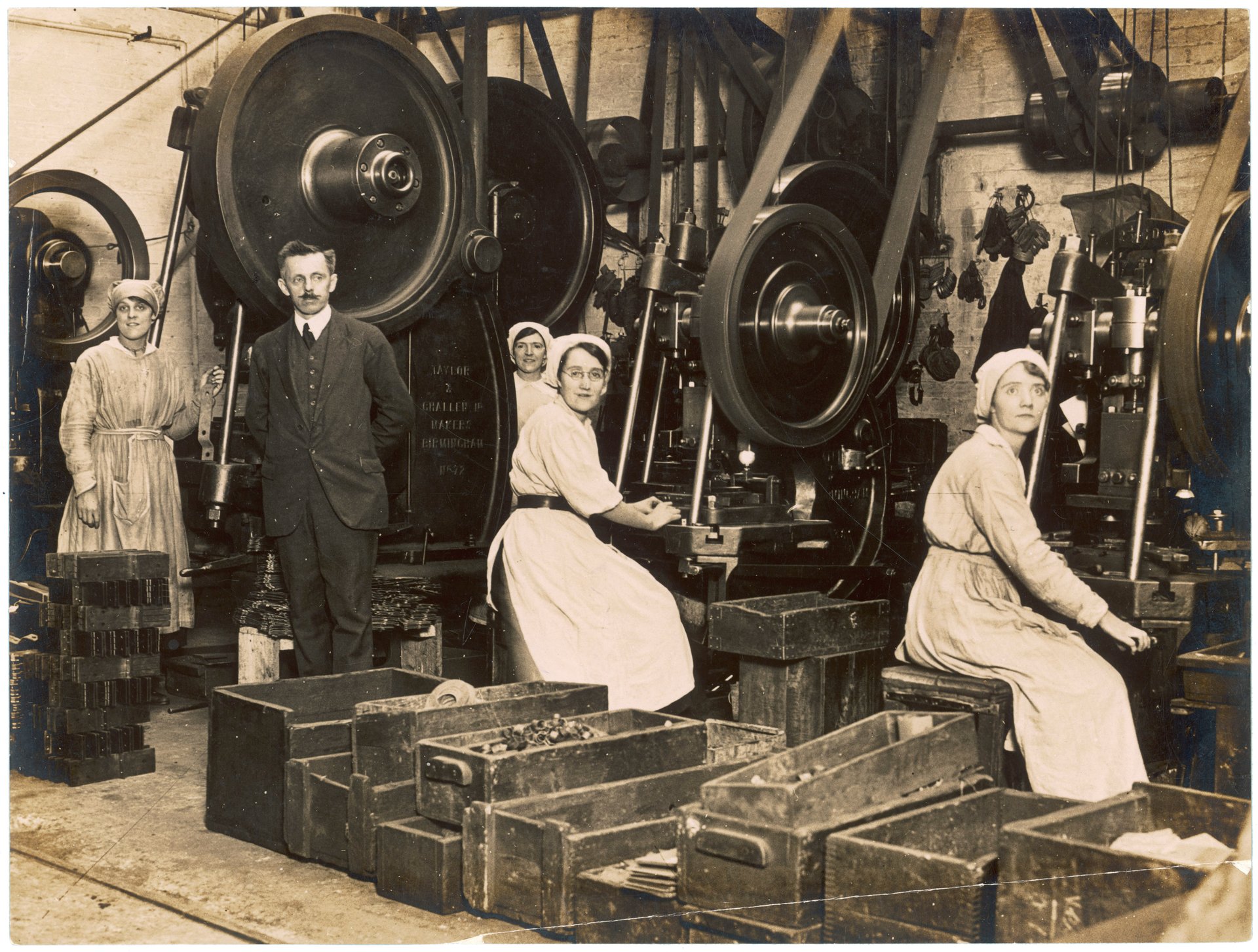 Old photo of people working in a factory